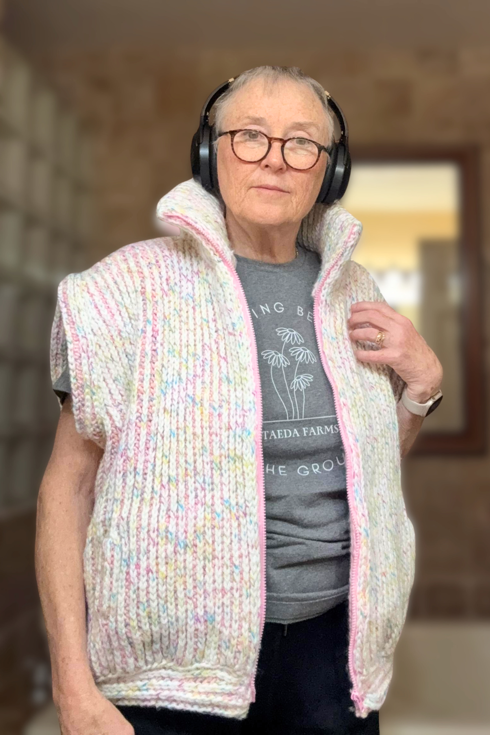 Brioche Crochet Vest — front view on size large tester in Birthday Cake colorway, sleeveless oversized fit shown on a taller frame, worn open over a tee.