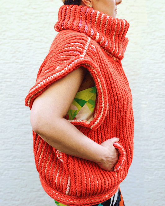 Brioche Crochet Vest — side view in Sherbet colorway on size medium designer, oversized sleeveless silhouette with deep armhole drop from side-to-side modular construction.