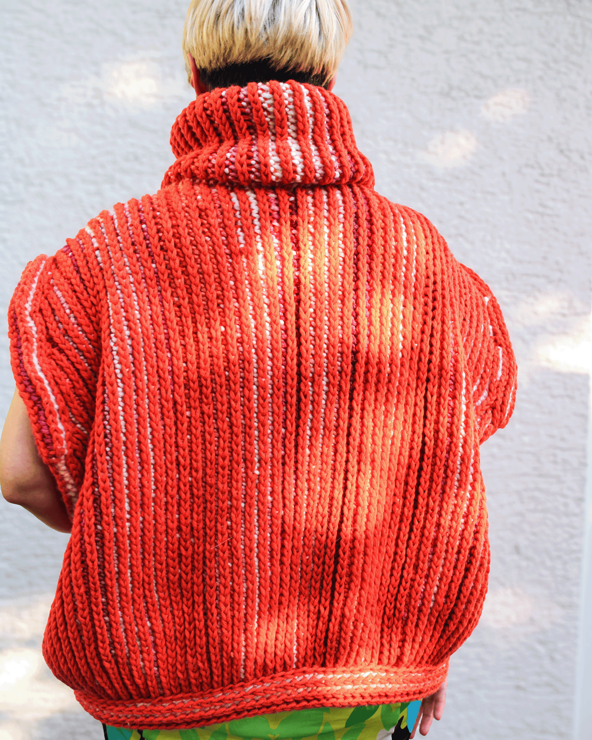 Brioche Crochet Vest — back view in Sherbet colorway on size medium designer, sun-catching two-color brioche stitch ribs across the back panel of the chunky sleeveless silhouette.